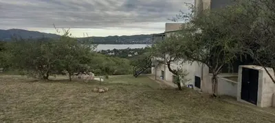 a house with a view of a body of water at El Paisaje in Villa Parque Siquiman
