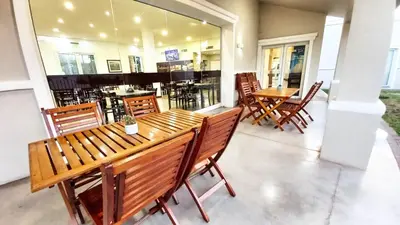 a dining room with wooden tables and chairs at Laplace Hotel in Cordoba