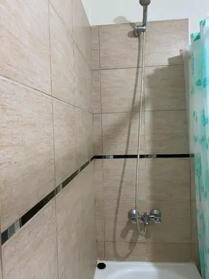 a bathroom with a shower with a sink at Blu Trino Departamento a metros de Barrio Güemes in Cordoba