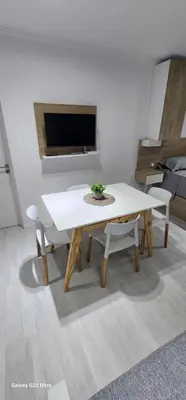 a white table and chairs in a living room at Miralejos 16 Apartamento in Villa Carlos Paz