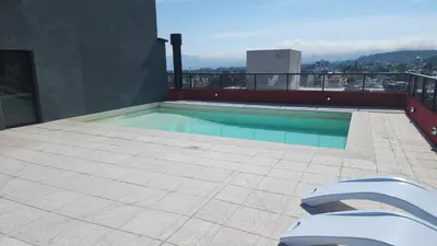 a swimming pool on the roof of a building at Miralejos 16 Apartamento in Villa Carlos Paz