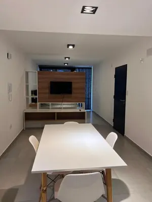 a living room with a white table and chairs at Alta Córdoba Nook in Cordoba