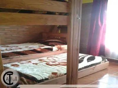 two twin bunk beds in a room withthritisthritisthritisthritisthritisthritisthritisthritis at Cabañas San Jose in Potrero de Garay