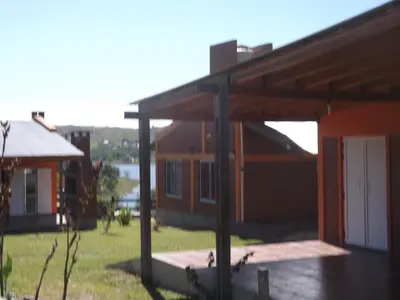a view of a house with a large open garage at Cabañas San Jose in Potrero de Garay