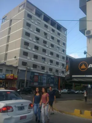 a group of people walking down a city street at CARLOS PAZ, Dpto, 3 Huésped in Villa Carlos Paz