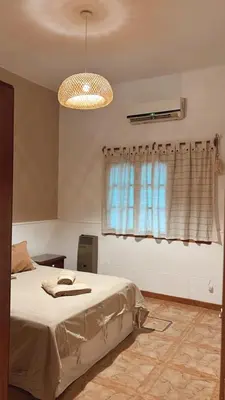 a bedroom with a bed and a window at Casa Criselo Multiespacio in Cordoba