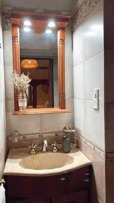 a bathroom with a sink and a mirror at Casa Criselo Multiespacio in Cordoba