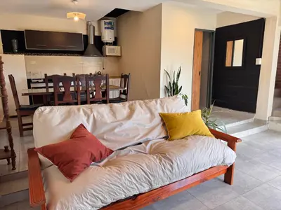 a living room with a couch with colorful pillows at Monte Loft in Mina Clavero