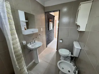 a bathroom with a toilet and a sink at Monte Loft in Mina Clavero