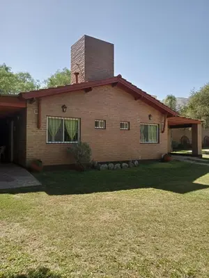 a brick house with a chimney on top of it at Los Estribos Merlo in Merlo