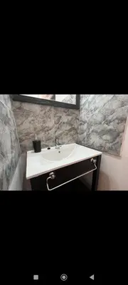 a bathroom with a white sink and a mirror at Manzanillas in Mina Clavero
