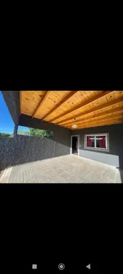 a view of a building with a wooden roof at Manzanillas in Mina Clavero