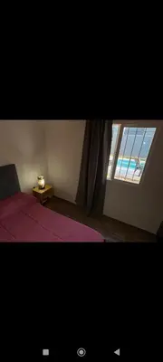 a bedroom with a bed and a window with a view at Manzanillas in Mina Clavero