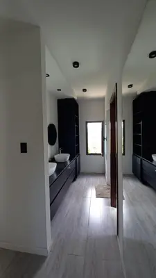 a large white bathroom with a sink and a mirror at Alojamiento en Villa La Bolsa in La Bolsa