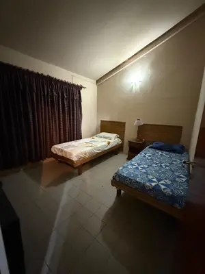 a room with two beds and a window in it at Alojamiento Lo de Jaime in Merlo