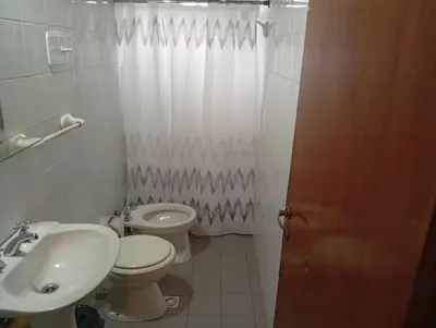 a bathroom with a toilet and a sink at Alojamiento Lo de Jaime in Merlo