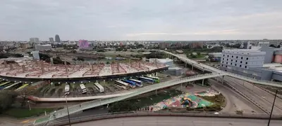an overhead view of a city with buses on a bridge at Departamento Lugones Nva Córdoba in Cordoba