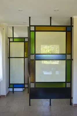 two stained glass windows in a room with a bench at Casa Almendro-Chumamaya-Villa de Merlo in Country Club Chumamaya