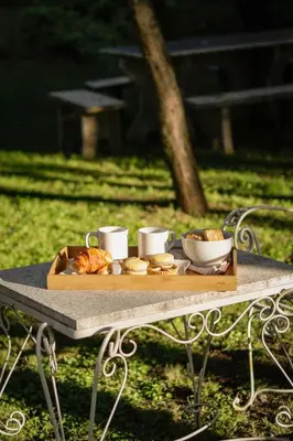 a tray of bread and pastries on a table at La Tranquilidad in Merlo