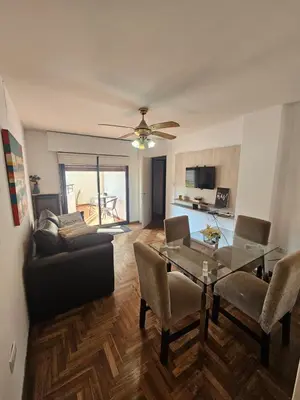 a living room with a couch and a table at Mamina Apartamento in Cordoba