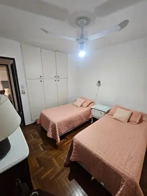 a bedroom with two beds and a ceiling at Mamina Apartamento in Cordoba