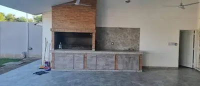 an empty garage with a large entertainment center at Cabaña De La Sierra in Villa Yacanto