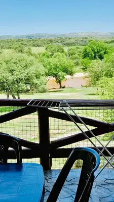a view of a view of a river from a viewing deck at Cabañas la posada de kika in Arroyo de Los Patos