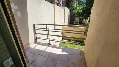 a balcony with a metal railing on a building at Departamento Salguero Nueva Córdoba in Cordoba