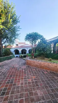 a brick walkway in front of a building at Casa Dos Lunas Cordoba in Cordoba