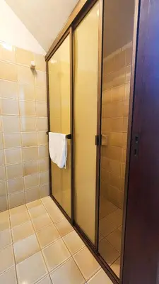 a shower with a glass door in a bathroom at Casa Dos Lunas Cordoba in Cordoba