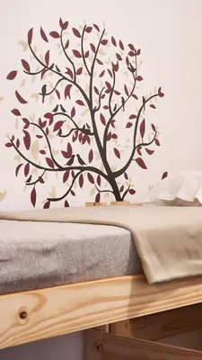 a tree vinyl wall decal on a bedroom wall at Casa Dos Lunas Cordoba in Cordoba