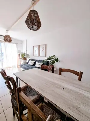 a living room with a wooden table and a couch at Dpto independencia 1446 - Pileta, Terraza, Asadores in Cordoba