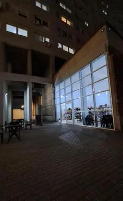 a large building with large windows in a city at Departamento Antigua Cervecería - Nati - in Cordoba