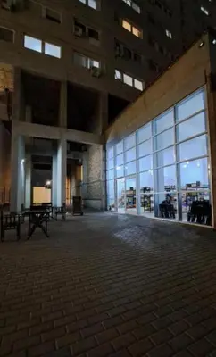 a large building with a large glass window at Departamento Antigua Cervecería - Nati - in Cordoba