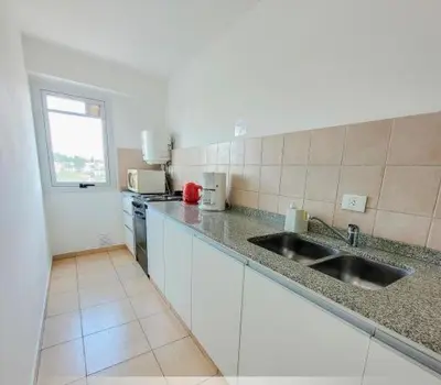 a kitchen with a sink and a counter top at Departamento Antigua Cervecería - Nati - in Cordoba
