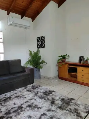 a living room with a couch and a table at Alquiler luque in Mina Clavero