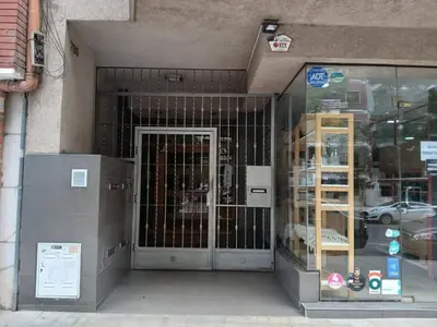 a store front with a glass door in a building at Departamento con Encanto Nueva Córdoba 2 in Cordoba