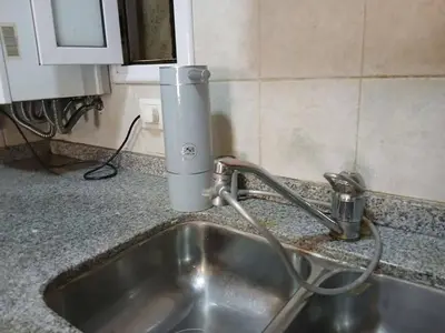 a kitchen sink with a faucet on a counter at Departamento con Encanto Nueva Córdoba 2 in Cordoba
