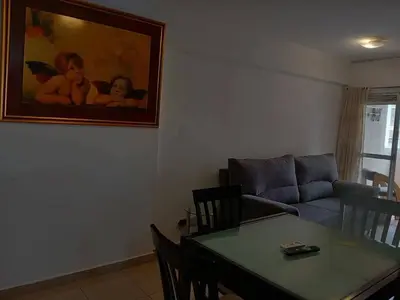 a living room with a table and a couch at Departamento con Encanto Nueva Córdoba 2 in Cordoba