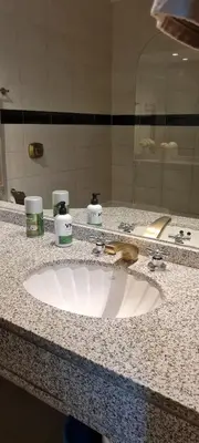 a bathroom counter with a sink and a mirror at Monoambiente Centrico in Cordoba