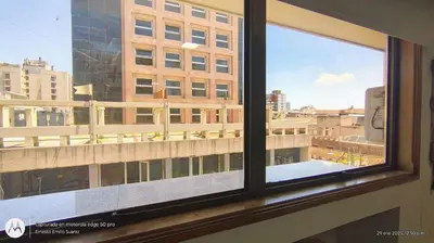 a window with a view of a building at Monoambiente Centrico in Cordoba