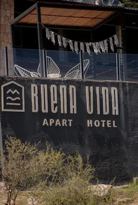 a sign for a hotel in front of a building at BUENA VIDA I Apart Hotel in Villa Icho Cruz