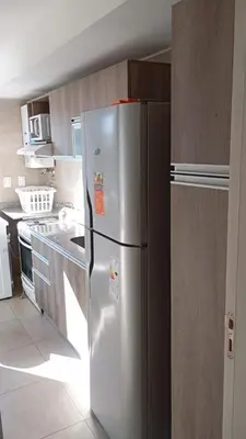 a kitchen with a stainless steel refrigerator in a kitchen at Departamento zipoli in Cordoba
