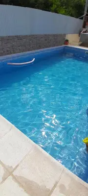 a blue swimming pool with a frisbee in it at MabiSil in Mina Clavero