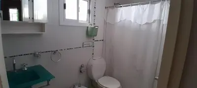 a white bathroom with a toilet and a shower at MabiSil in Mina Clavero