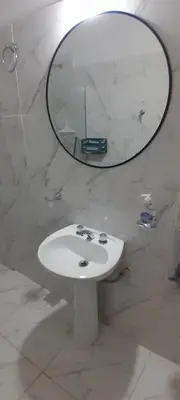 a bathroom with a white sink and a mirror at MabiSil in Mina Clavero