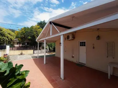 a patio with a white roof and a white door at Alquilo Dpto en Villa Carlos Paz in Villa Carlos Paz