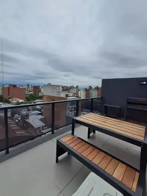 a bench sitting on top of a balcony at Av Velez Sarsfield 700 B Nueva Cordoba in Cordoba