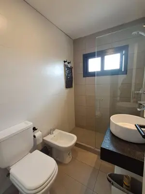 a bathroom with a toilet and a sink and a shower at Av Velez Sarsfield 700 B Nueva Cordoba in Cordoba