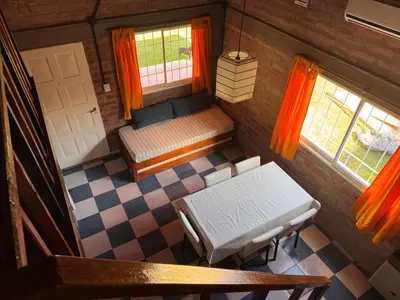 an overhead view of a room with a bed and window at Casa Terra in Mina Clavero